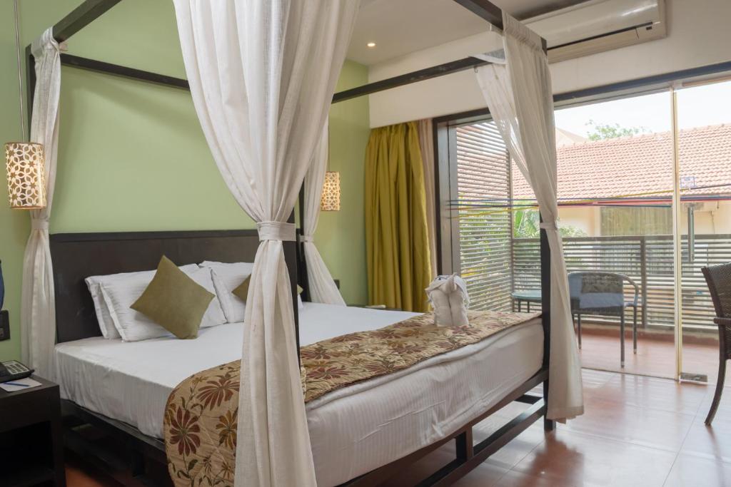 Двухместный (Улучшенный двухместный номер с 1 кроватью или 2 отдельными кроватями) отеля Citrus Goa, Калангут