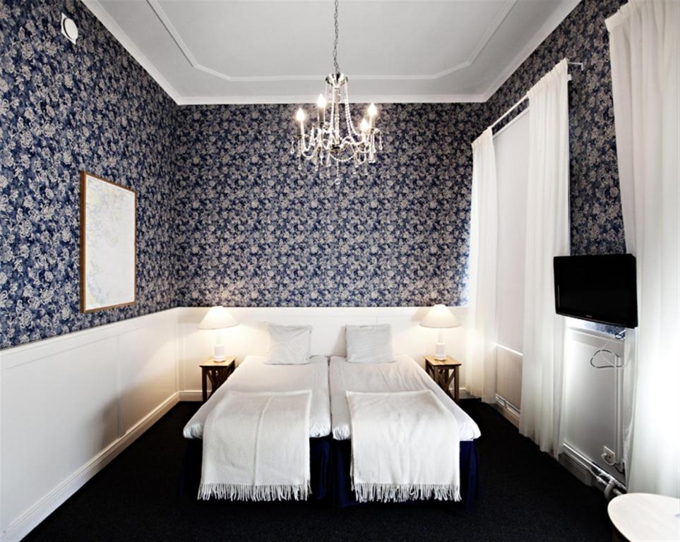 Двухместный (Улучшенный двухместный номер с 2 отдельными кроватями) отеля First Hotel Statt, Худиксвалль