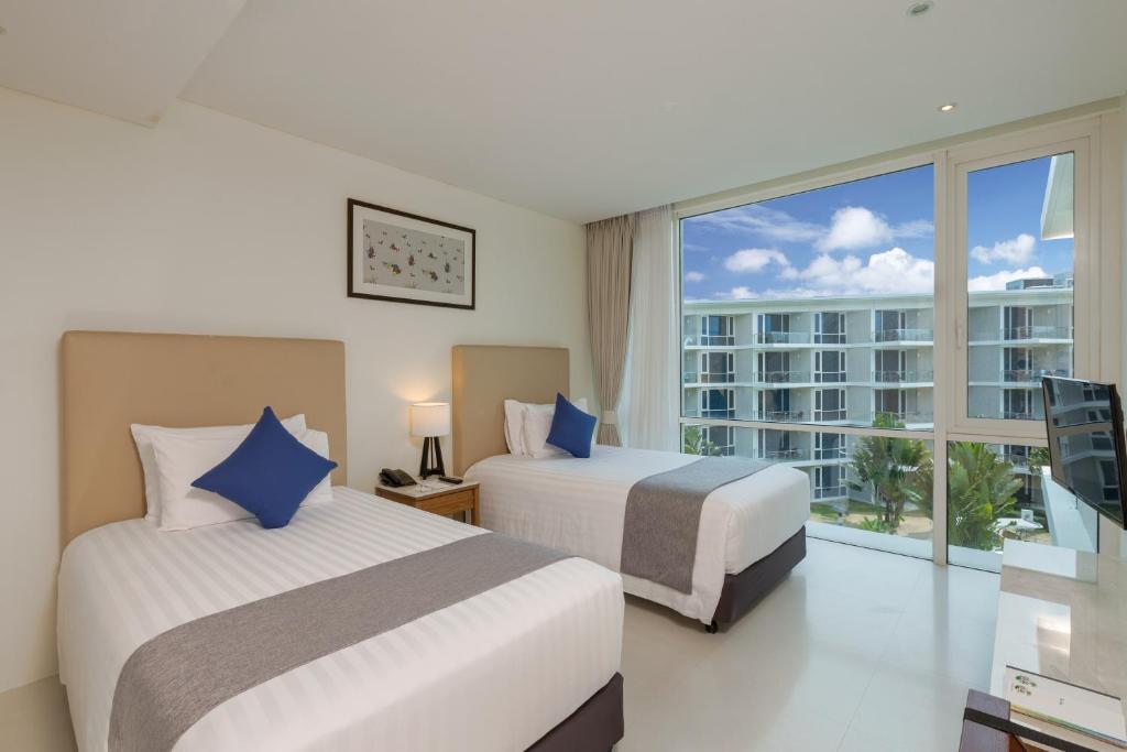 Двухместный (Двухместный номер Делюкс с 2 отдельными кроватями и без балкона) курортного отеля Grand West Sands Resort & Villas Phuket, Пхукет