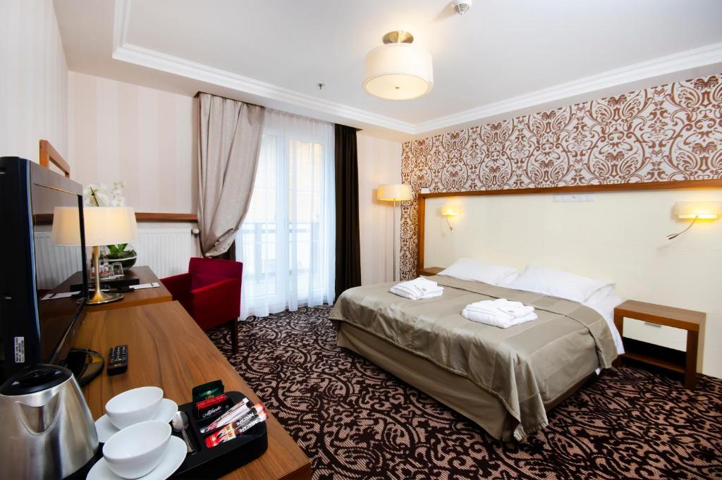 Двухместный (Двухместный номер в отдельном здании, с 1 двуспальной или 2 отдельными кроватями) отеля Hotel Czarny Potok Resort SPA & Conference, Крыница