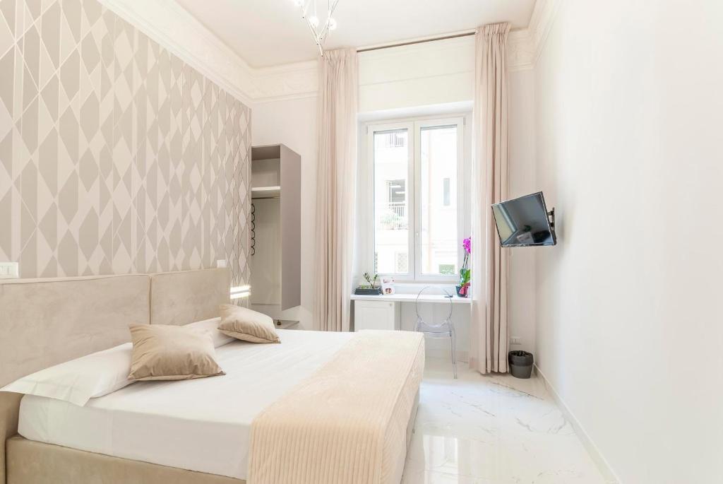 Двухместный (Улучшенный двухместный номер с 1 кроватью или 2 отдельными кроватями) отеля Bea Suites Luxury Rooms, Рим
