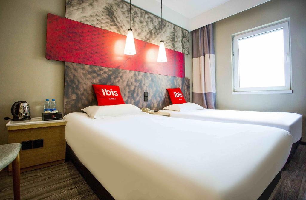 Двухместный (Бюджетный двухместный номер с 2 отдельными кроватями) отеля Hotel Ibis Qingdao Ningxia, Циндао