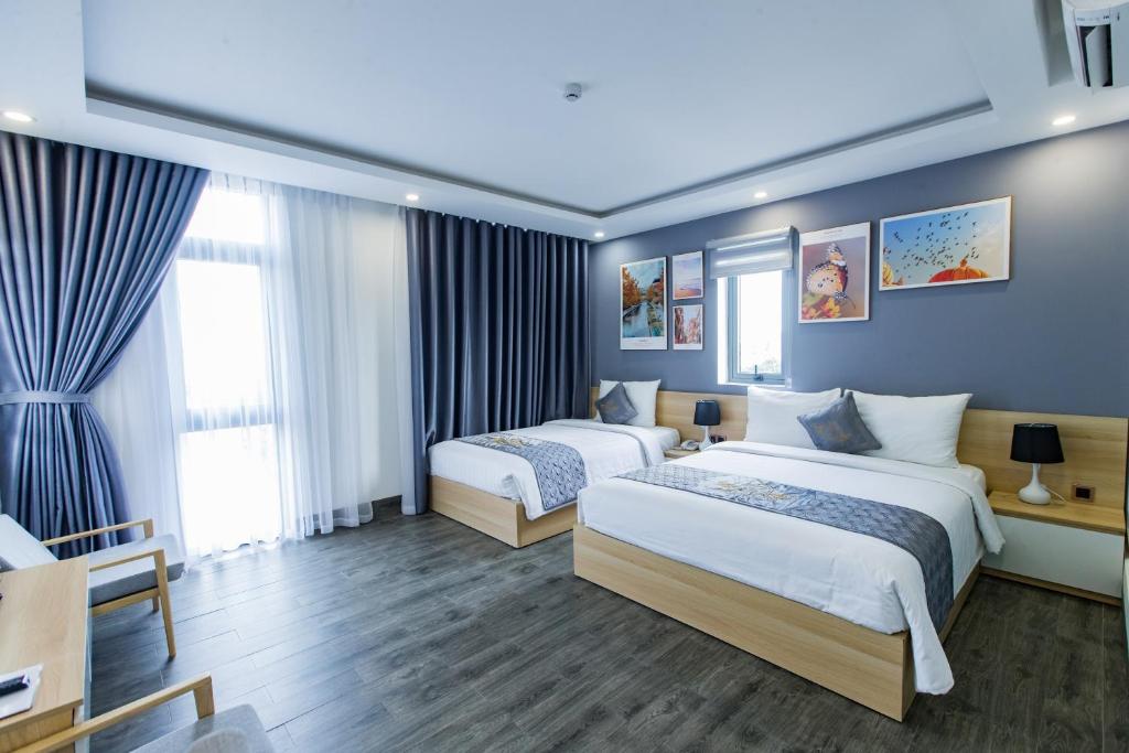 Двухместный (Улучшенный двухместный номер Делюкс с 1 кроватью или 2 отдельными кроватями) отеля Dang's Hotel, Дананг