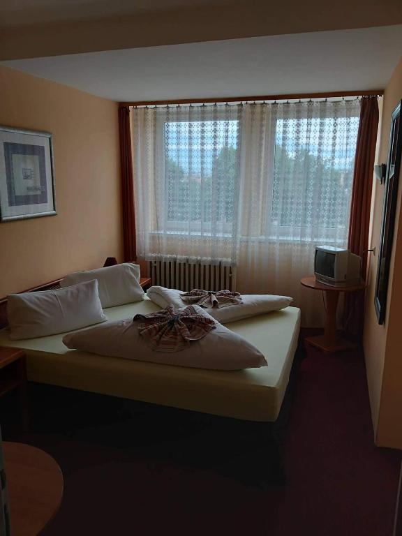 Четырехместный (Стандартный четырехместный номер) отеля Hotel Gerlach, Попрад