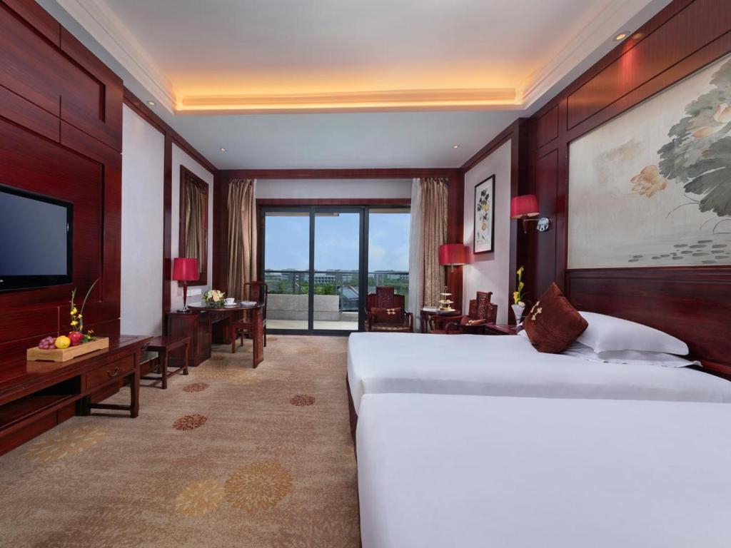 Двухместный (Улучшенный двухместный номер с 2 отдельными кроватями и видом на сад) отеля Hangzhou Blossom Water Museum Hotel, Ханчжоу