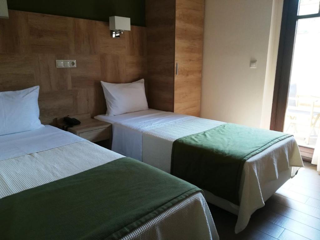 Двухместный (Двухместный номер эконом-класса с 2 отдельными кроватями) отеля Konaki Ouranoupolis, Уранополис