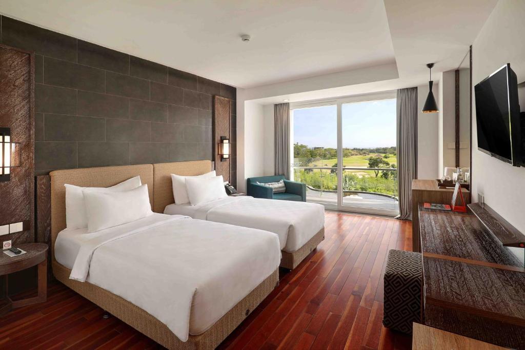 Двухместный (Двухместный номер Делюкс с 2 отдельными кроватями и балконом) отеля Swiss-Belresort Pecatu, Улувату