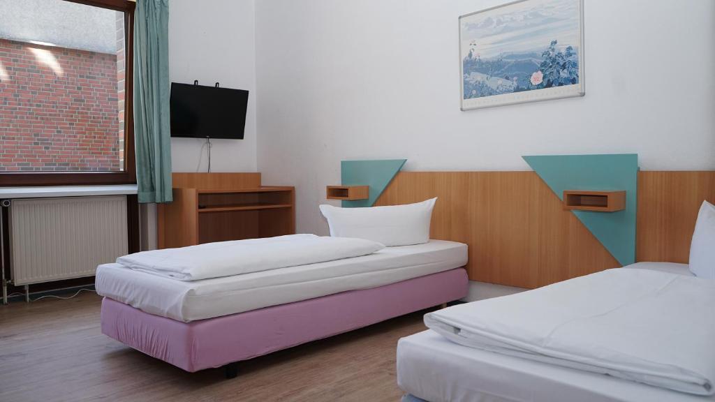 Двухместный (Двухместный номер с 2 отдельными кроватями в гостевом доме с общей ванной комнатой) отеля Entrée Hotel Glinde, Гамбург