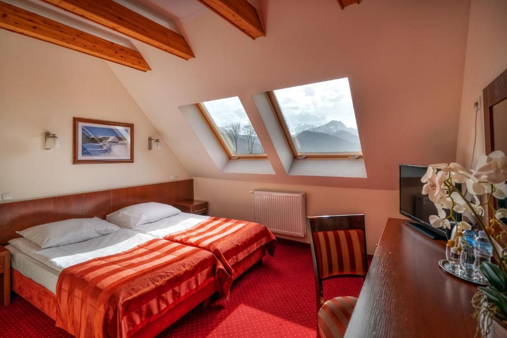 Двухместный (Стандартный двухместный номер с 2 отдельными кроватями) отеля Hotel Tatra, Закопане