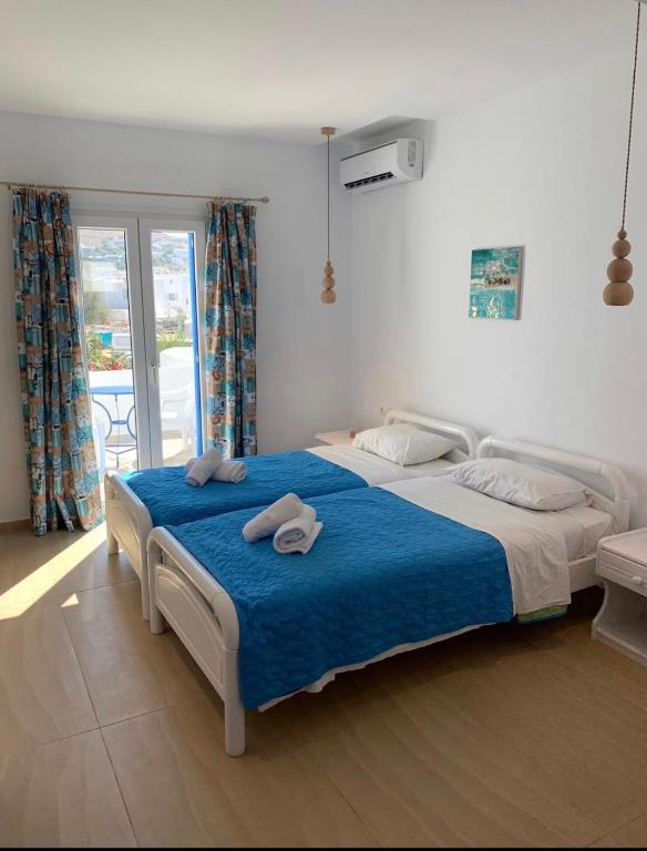Двухместный (Двухместный номер с 2 отдельными кроватями, вид на сад) апарт-отеля Anemos Apartments Орнос