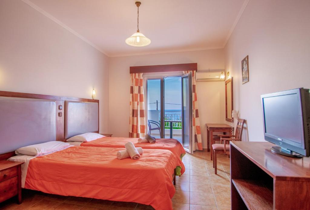 Двухместный (Стандартный двухместный номер с 1 кроватью или 2 отдельными кроватями, вид на море) апарт-отеля Agoulos Beach Hotel, Аргасион
