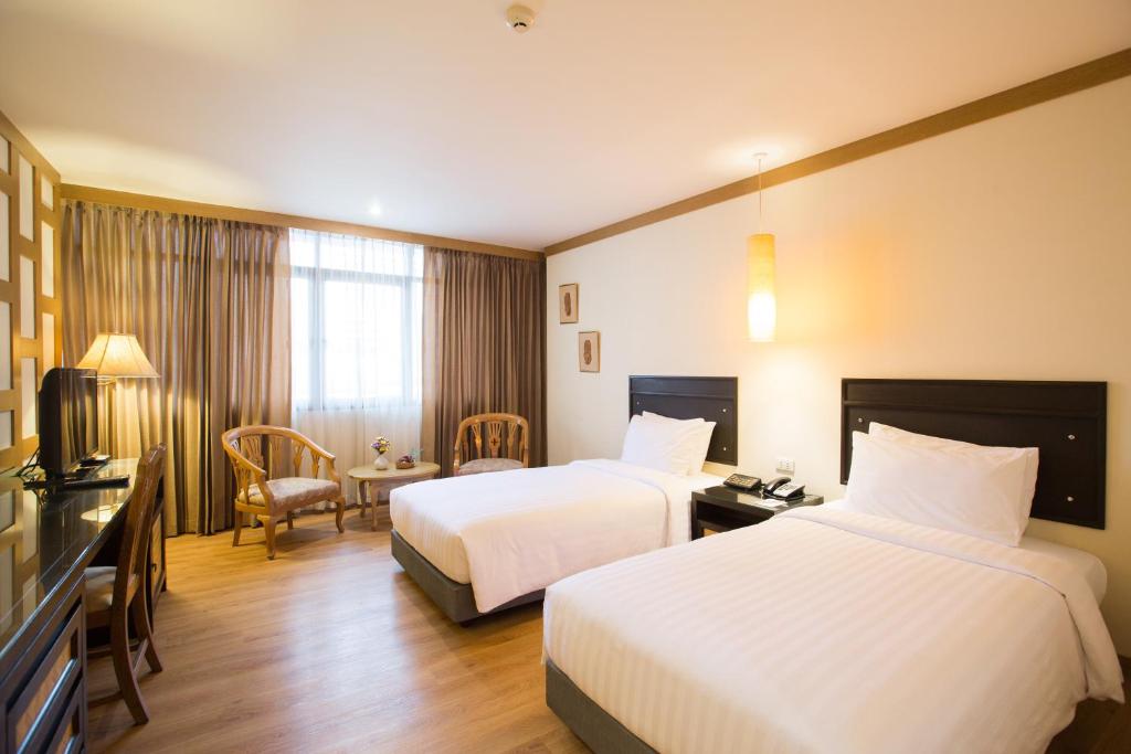 Двухместный (Двухместный номер Делюкс с 1 кроватью или 2 отдельными кроватями) отеля The Tarntawan Hotel Surawong Bangkok, Бангкок