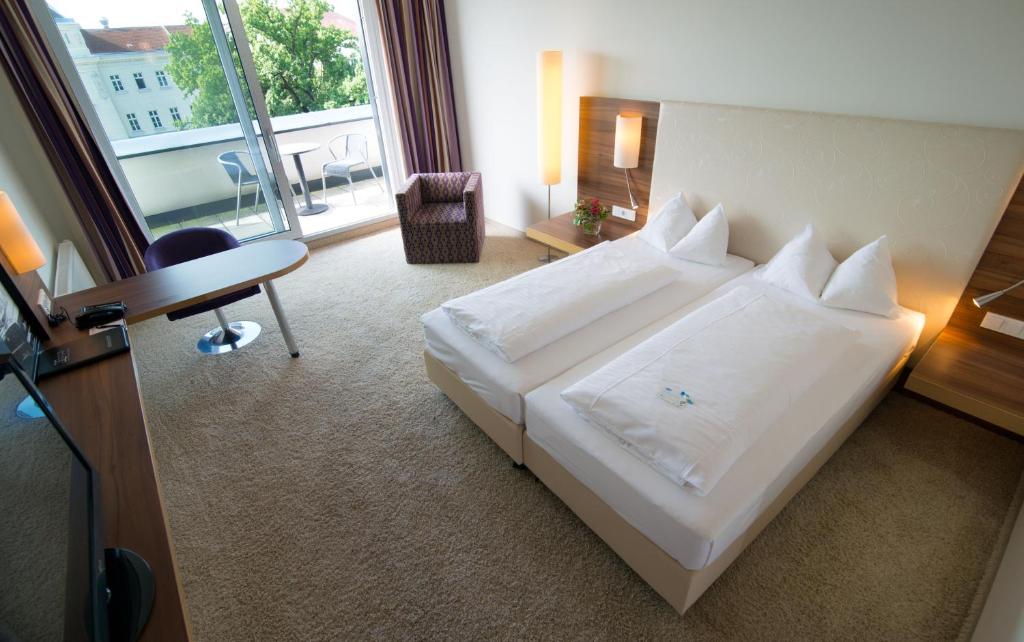 Двухместный (Улучшенный двухместный номер с 1 кроватью или 2 отдельными кроватями) отеля Cityhotel D&C St.Pölten, Санкт-Пёльтен
