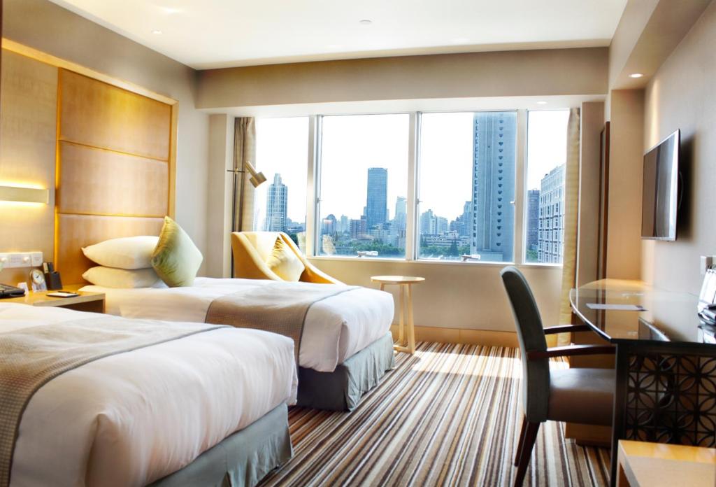 Двухместный (Двухместный номер Делюкс с 2 отдельными кроватями и видом на город) отеля Jin Jiang Tower, Шанхай