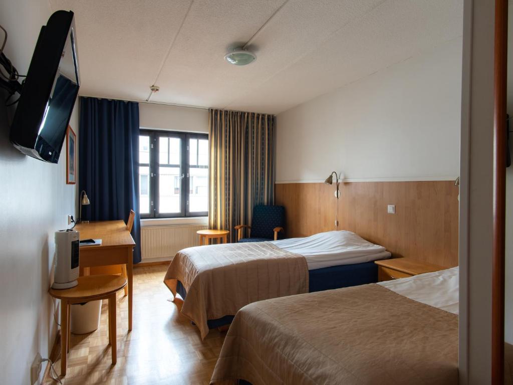 Двухместный (Стандартный двухместный номер с 2 отдельными кроватями) отеля Finlandia Hotel Jahtihovi, Куопио