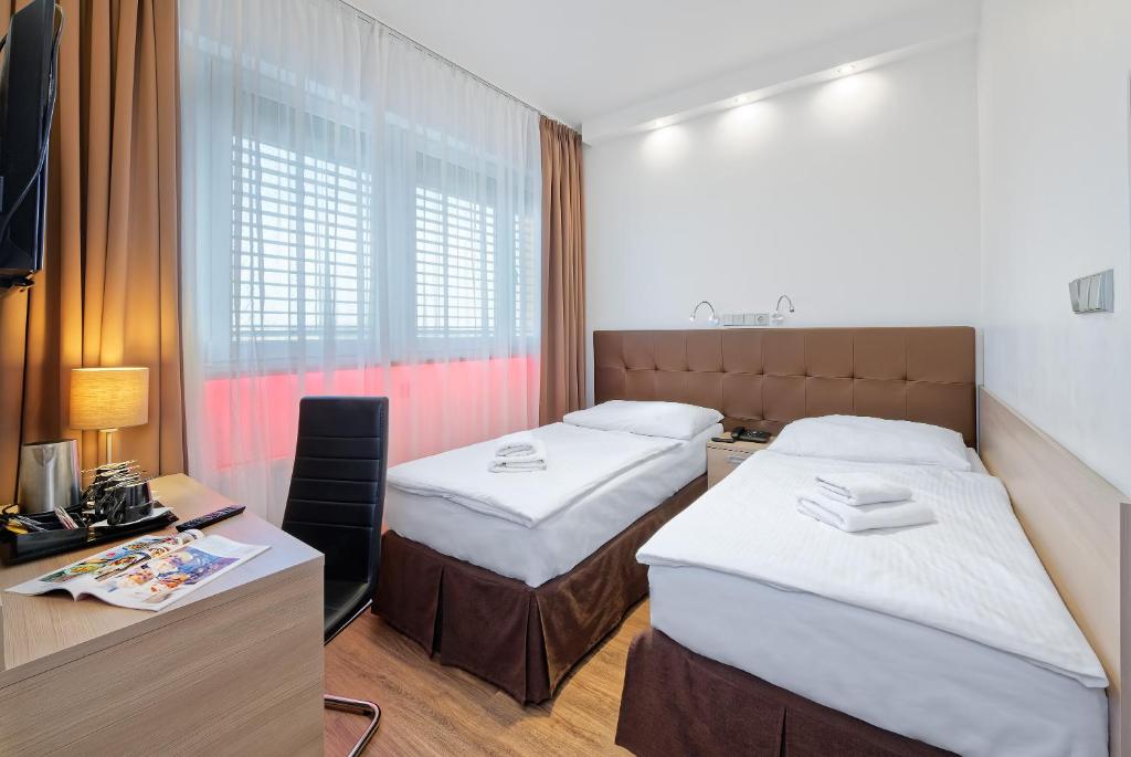 Двухместный (Стандартный двухместный номер с 1 кроватью или 2 отдельными кроватями) отеля Aura Design & Garden Pool, Прага