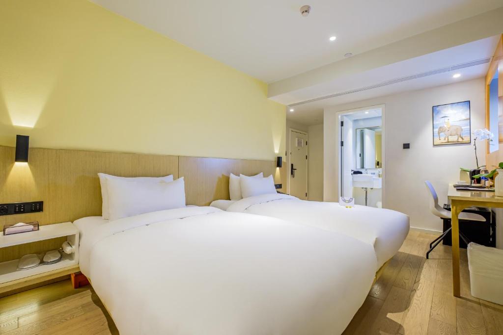 Двухместный (Улучшенный двухместный номер с 2 отдельными кроватями) отеля Pace Hotel, Сучжоу