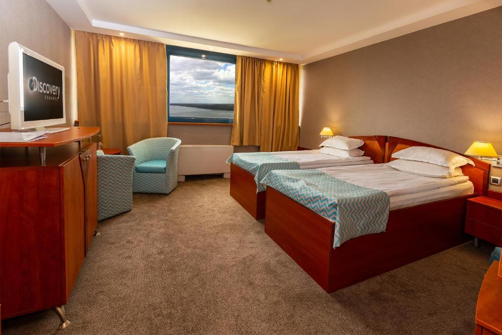 Двухместный (Стандартный двухместный номер с 1 кроватью или 2 отдельными кроватями, видом на реку и бесплатной парковкой) отеля Grand Hotel Riga, Русе