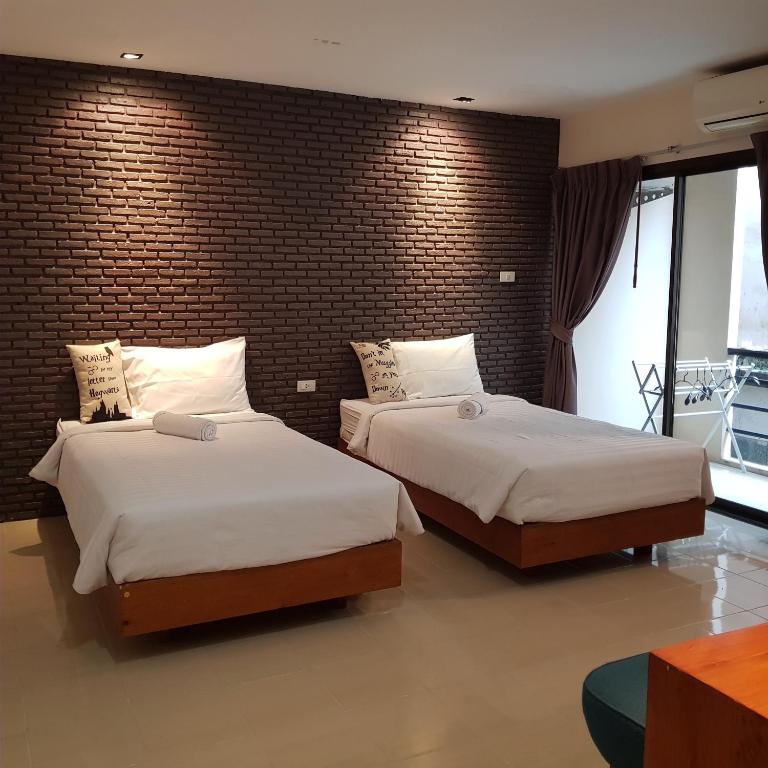Двухместный (Улучшенный двухместный номер с 2 отдельными кроватями) хостела Dfeel Hostel, Пхукет