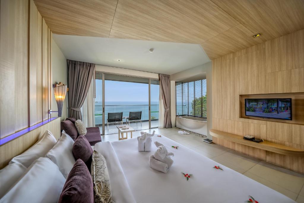 Двухместный (Двухместный номер Гранд Делюкс с 1 кроватью или 2 отдельными кроватями и видом на море) курортного отеля Kalima Resort and Spa, Пхукет