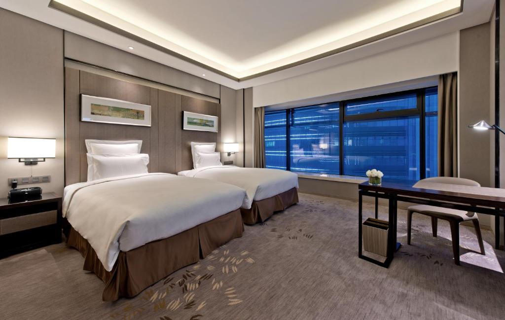 Двухместный (Представительский двухместный номер с 2 отдельными кроватями, право посещения представительского лаунджа) отеля Pullman Shanghai South, Шанхай