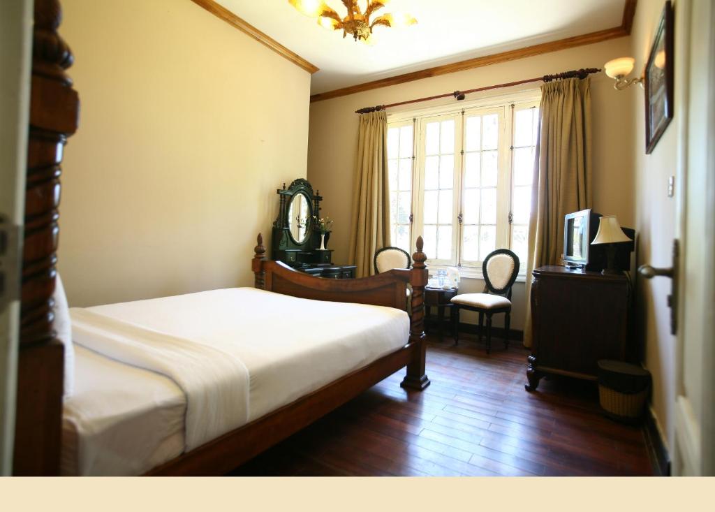 Двухместный (Улучшенный двухместный номер с 1 кроватью) отеля Dalat Cadasa Resort, Далат