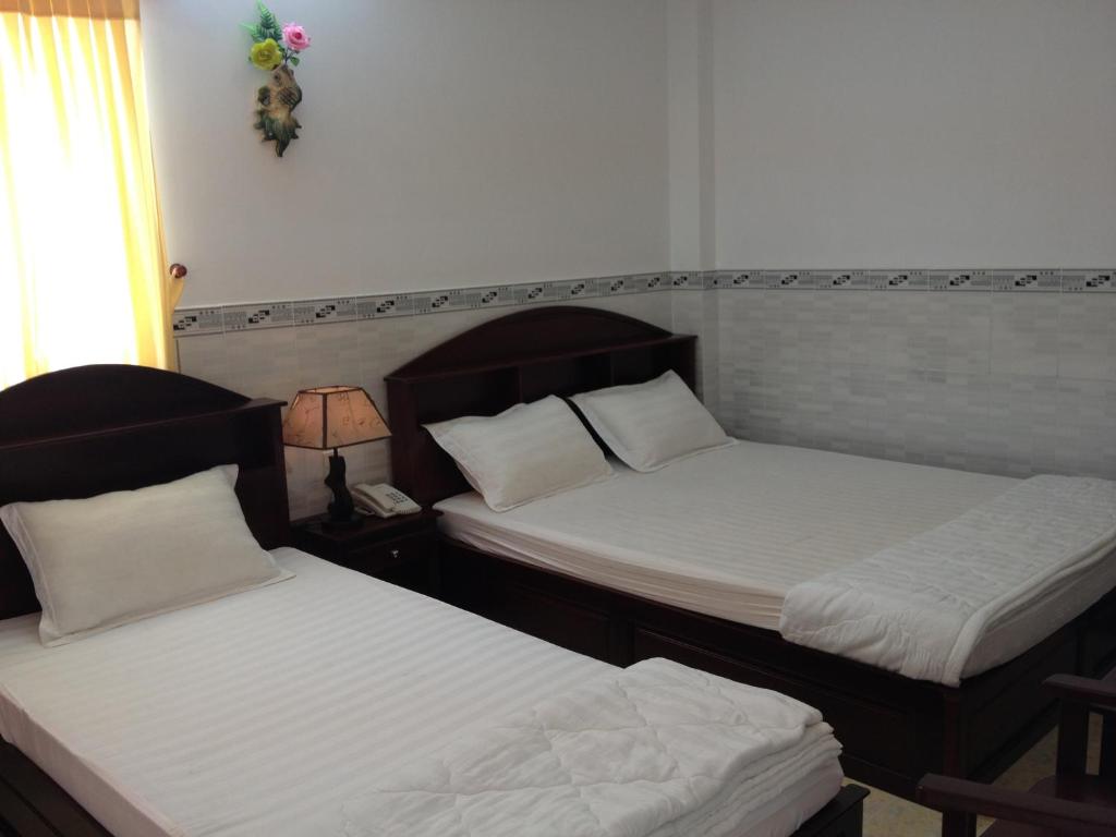 Трехместный (Улучшенный трехместный номер) отеля Huynh Lac Can Tho Hotel, Кантхо