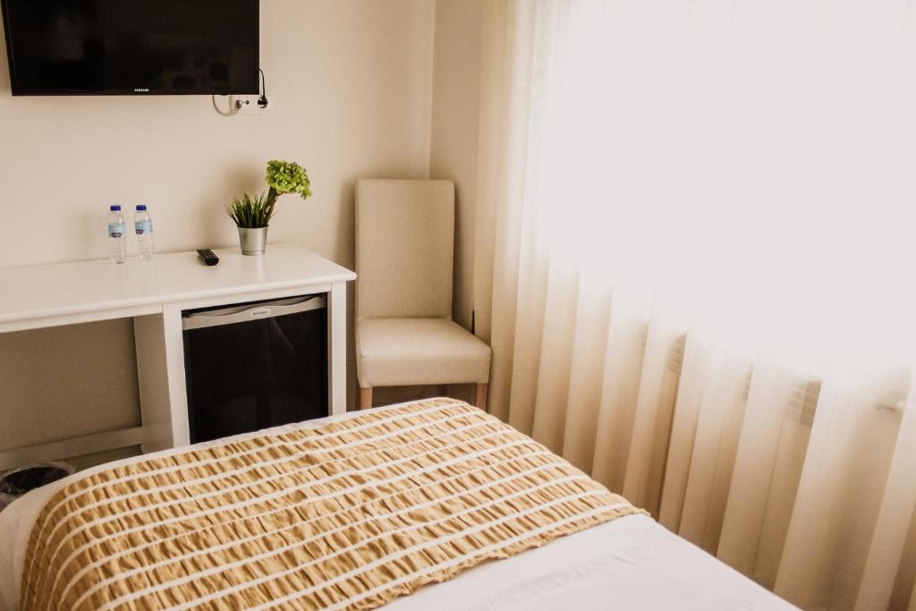 Двухместный (Двухместный номер с 2 отдельными кроватями) отеля Hotel Neptuno, Коимбра