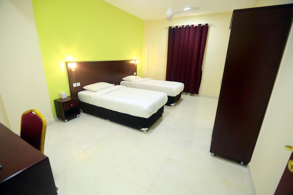 Апартаменты (Two Bedroom Apartment without Living Room) апарт-отеля Al Dhiyafa Palace Hotel Apartments, Маскат