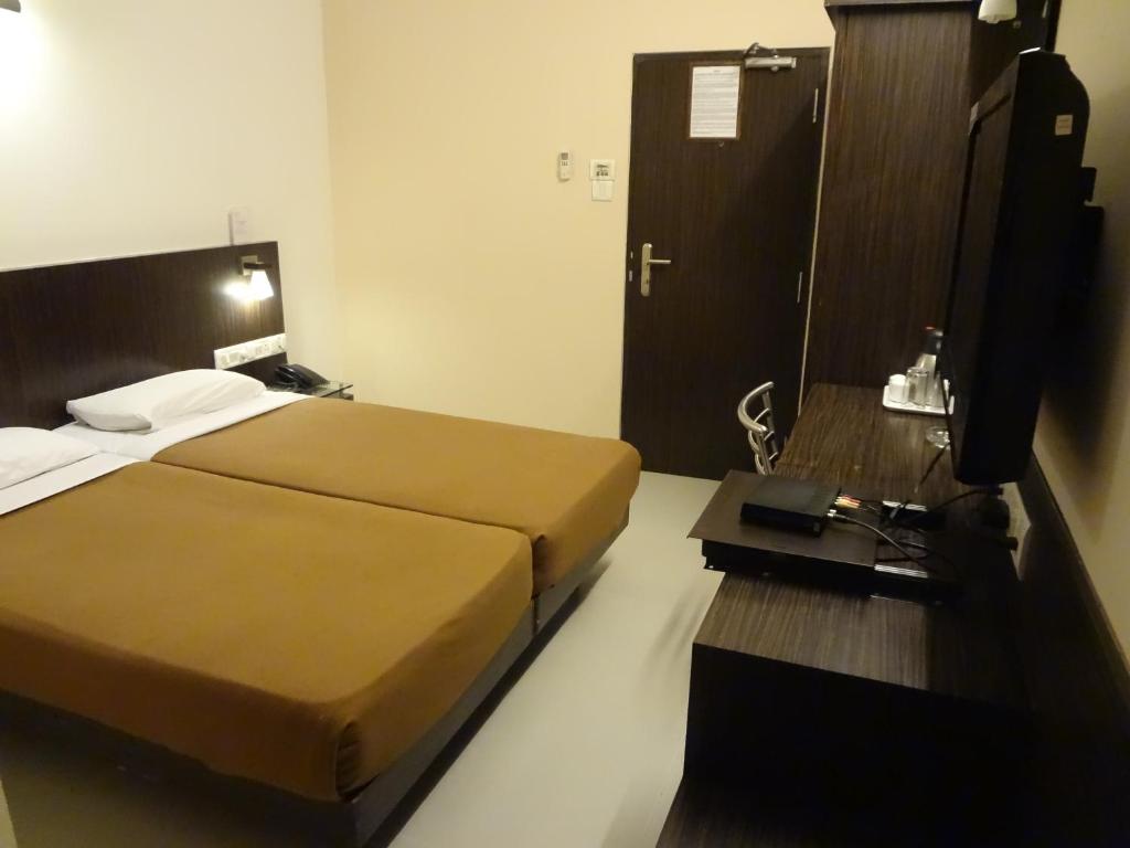 Двухместный (Двухместный номер Делюкс с 1 кроватью или 2 отдельными кроватями) отеля Rama Krishna Hotel, Мумбай