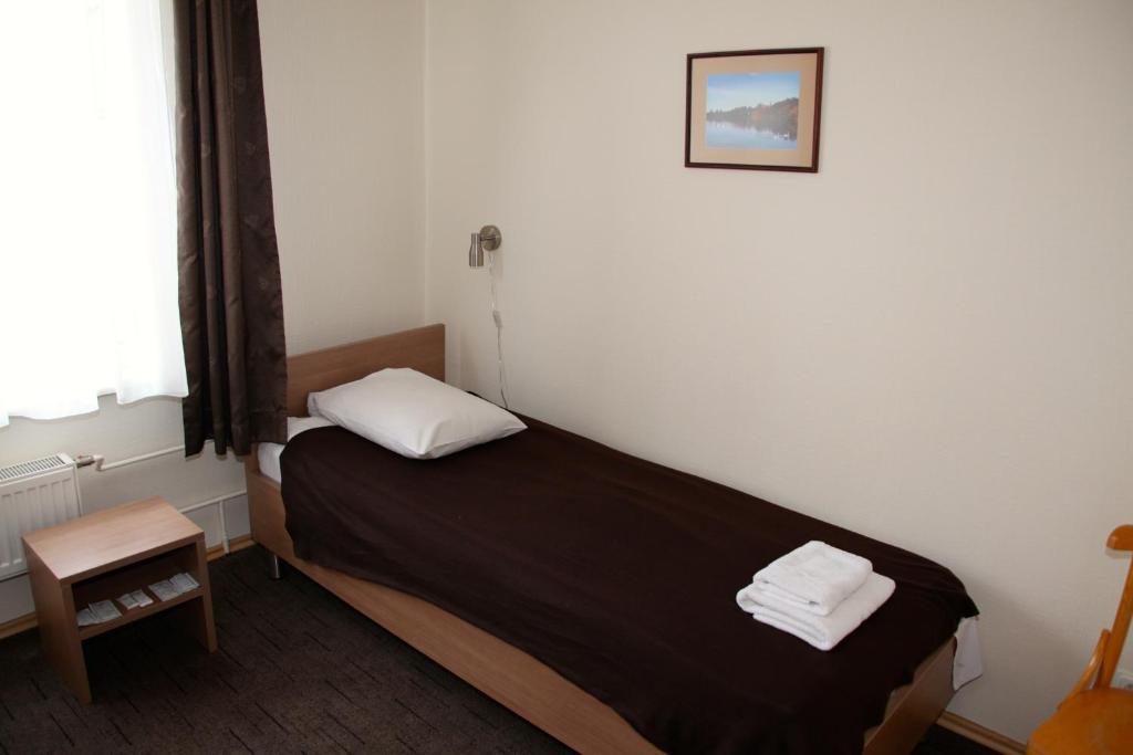 Двухместный (Двухместный номер с 2 отдельными кроватями) отеля Hotel Dobele, Елгава
