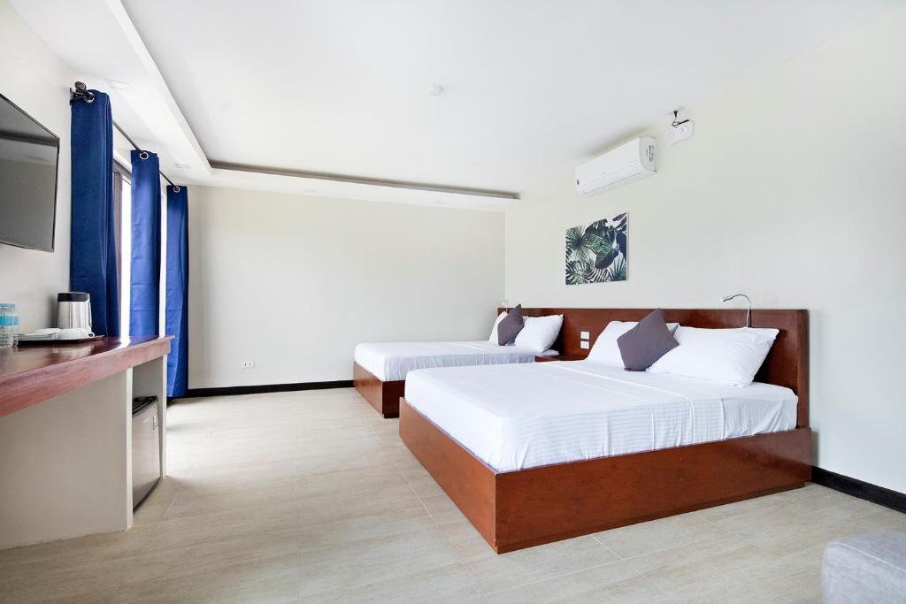 Четырехместный (Номер Делюкс с 2 кроватями размера «queen-size») курортного отеля OHANA, Panglao Resort., Панглао