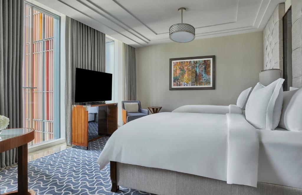 Двухместный (Номер Делюкс с 2 отдельными кроватями) отеля Four Seasons Hotel Abu Dhabi at Al Maryah Island, Абу-Даби