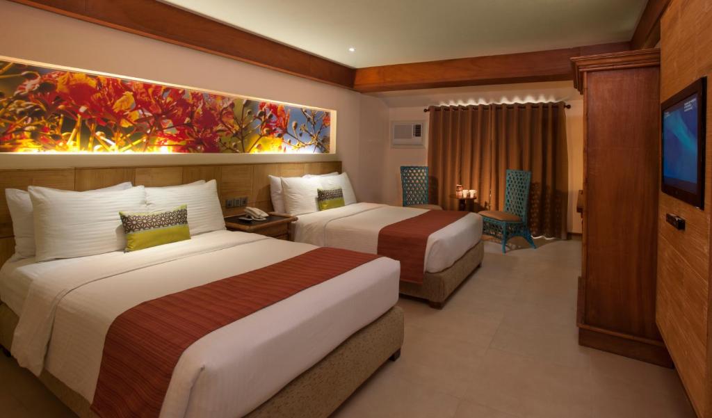Двухместный (Улучшенный двухместный номер с 2 отдельными кроватями) курортного отеля Costabella Tropical Beach Hotel, Мактан
