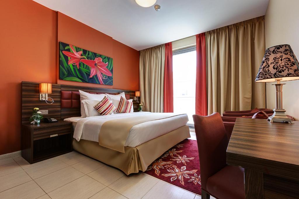 Апартаменты (Апартаменты Делюкс с 1 спальней и балконом - В стоимость входит поздняя регистрация отъезда до 14:00, ранняя регистрация заезда до 12:00 и скидка) апарт-отеля Abidos Hotel Apartment Dubai Land, Дубай
