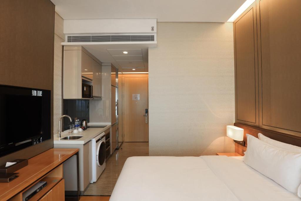 Двухместный (Апартаменты Делюкс с кроватью размера «queen-size») отеля Vaperse Hotel, Гуанчжоу
