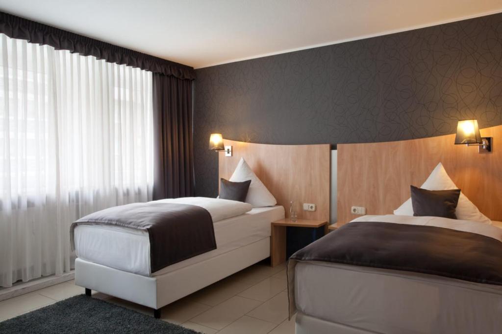 Двухместный (Двухместный номер с 1 кроватью или 2 отдельными кроватями) отеля Hotel Asahi, Дюссельдорф
