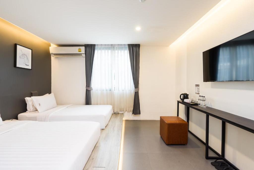 Двухместный (Двухместный номер Делюкс с 1 кроватью или 2 отдельными кроватями, вид на город) отеля Marwin Space, Бангкок