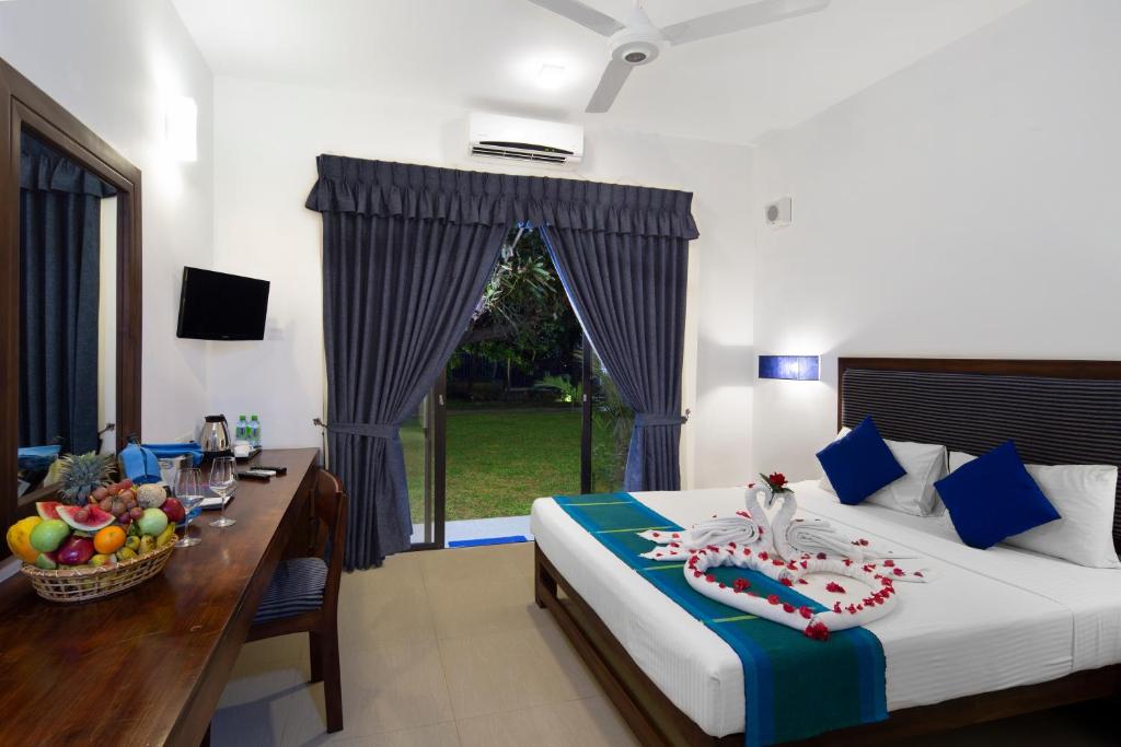 Двухместный (Двухместный номер Делюкс с 1 кроватью или 2 отдельными кроватями и балконом) отеля The Blue Wave Hotel, Аругам