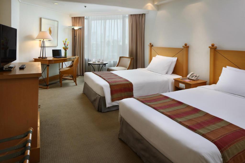 Двухместный (Двухместный номер Делюкс с 1 кроватью или 2 отдельными кроватями) отеля The Heritage Hotel Manila, Манила
