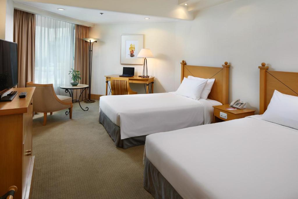 Двухместный (Улучшенный двухместный номер с 1 кроватью или 2 отдельными кроватями) отеля The Heritage Hotel Manila, Манила