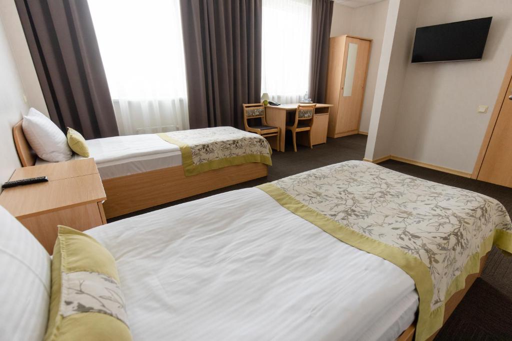 Двухместный (Двухместный номер с 2 отдельными кроватями) отеля Hotel Naktsmajas, Валмиера