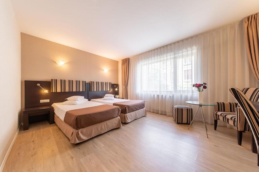 Двухместный (Двухместный номер с 2 отдельными кроватями - Подходит для гостей с ограниченными физическими возможностями) отеля Hotel Parliament, Бухарест