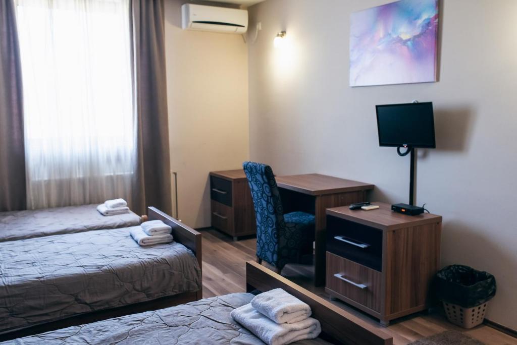 Двухместный (Улучшенный двухместный номер с 2 отдельными кроватями и видом на сад) отеля Hotel Euforia Lounge, Шабац