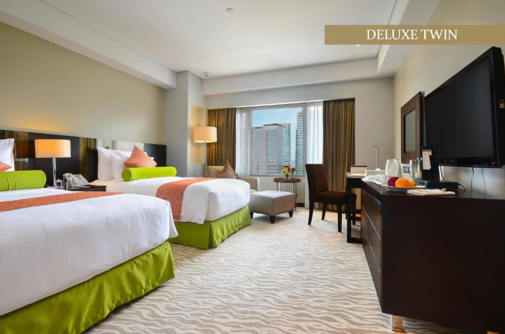 Двухместный (Двухместный номер Делюкс с 2 отдельными кроватями) отеля Acacia Hotel Manila, Манила