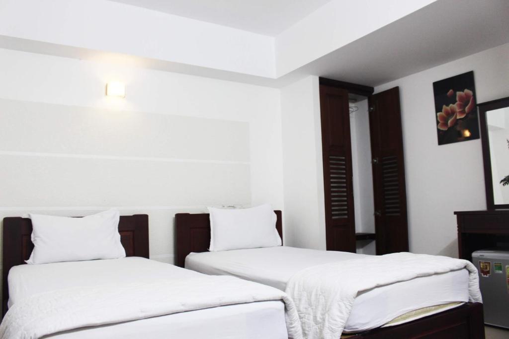 Двухместный (Улучшенный двухместный номер с 2 отдельными кроватями) отеля Dinh Dinh 2 Hotel, Хошимин