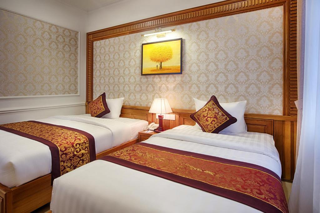 Двухместный (Улучшенный двухместный номер с 2 отдельными кроватями) отеля Riverside Hotel - Quang Binh, Донгхой