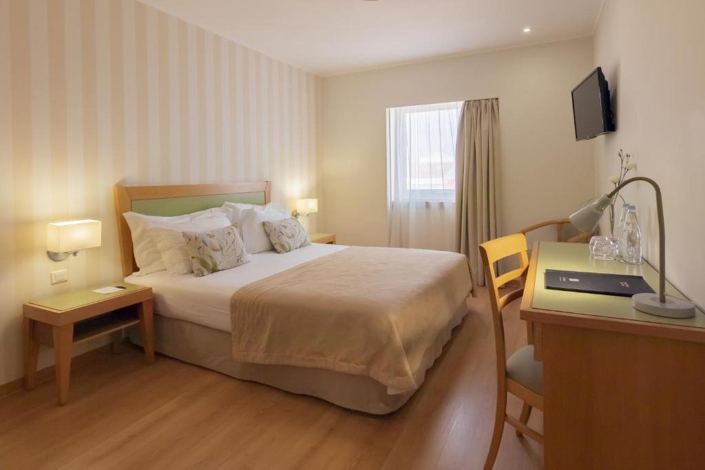 Двухместный (Двухместный номер с 1 кроватью или 2 отдельными кроватями) отеля Luna Esperanca Centro Hotel, Сетубал