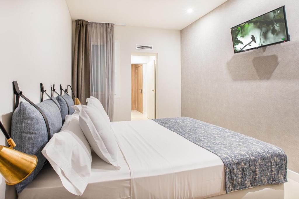 Двухместный (Стандартный двухместный номер с 1 кроватью или 2 отдельными кроватями) отеля Casa Lirio, Барселона
