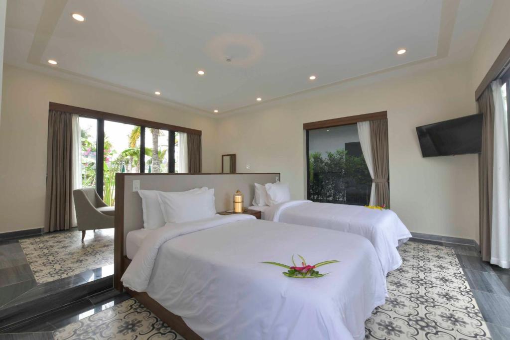 Вилла (One-Bedroom Villa with Garden View - 2 Twin beds) курортного отеля Cocoland River Beach Resort & Spa, Куангнгай